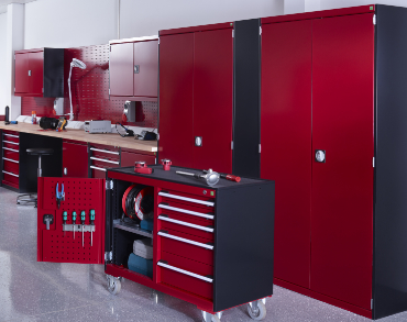 Red and black storage cabinets fitted in a maintenance workshop with a mobile drawer cabinet